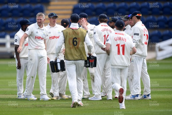 040525 - Glamorgan v Derbyshire - Rothesay County Championship - Timm Van Der Gugten of Glamorgan celebrates taking the wicket of Alex Thomson of Derbyshire with teammates