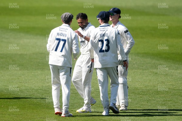 040525 - Glamorgan v Derbyshire - Rothesay County Championship - Sam Northeast of Glamorgan is bowled out by Anuj Dal of Derbyshire and celebrates with team mates