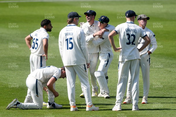 040525 - Glamorgan v Derbyshire - Rothesay County Championship - Sam Northeast of Glamorgan is bowled out by Anuj Dal of Derbyshire and celebrates with team mates