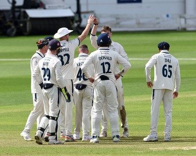 120424 - Glamorgan v Derbyshire - Vitality County Championship, Division 2 - Blair Tickner of Derbyshire celebrates taking the wicket of Sam Northeast of Glamorgan