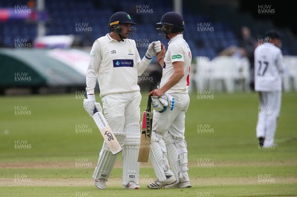120619 - Glamorgan v Derbyshire, Specsavers County Championship Division 2 - Lukas Carey of Glamorgan, left, with Graham Wagg of Glamorgan as he reaches his 50