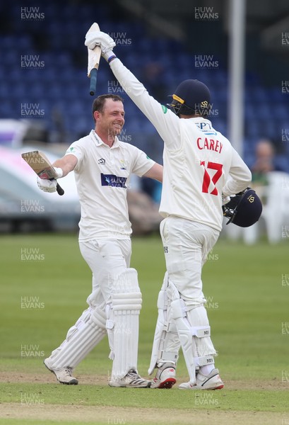 120619 - Glamorgan v Derbyshire, Specsavers County Championship Division 2 - Graham Wagg of Glamorgan celebrates with Lukas Carey of Glamorgan as he reaches his 100