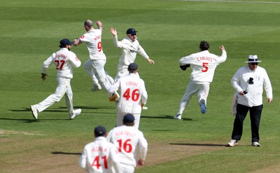 150424 - Glamorgan v Derbyshire - Vitality County Championship, Division Two - Mason Crane of Glamorgan celebrates with team mates after running out David Lloyd of Derbyshire