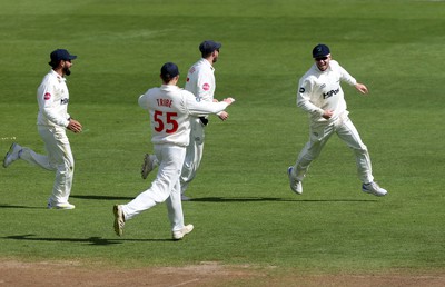 150424 - Glamorgan v Derbyshire - Vitality County Championship, Division Two - Mason Crane of Glamorgan celebrates with team mates after running out David Lloyd of Derbyshire