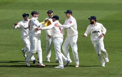 150424 - Glamorgan v Derbyshire - Vitality County Championship, Division Two - Mason Crane of Glamorgan celebrates with team mates after running out David Lloyd of Derbyshire