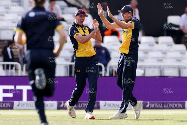 190821 - Glamorgan v Durham - Royal London One Day Final - James Weighell of Glamorgan celebrates with Michael Hogan as he catches the ball to dismiss David Bedingham