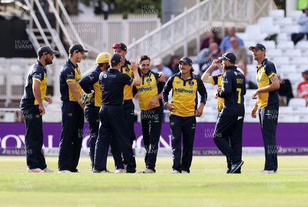 190821 - Glamorgan v Durham - Royal London One Day Final - Andrew Salter of Glamorgan and team mates celebrate after David Bedingham is caught by James Weighell
