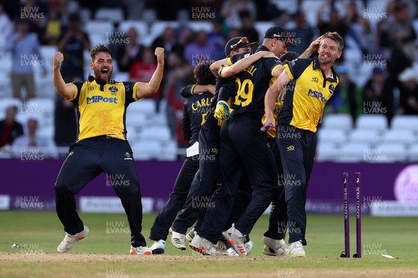 190821 - Glamorgan v Durham - Royal London One Day Final - Michael Hogan of Glamorgan pulls the wicket out the pitch as Glamorgan celebrate winning the game