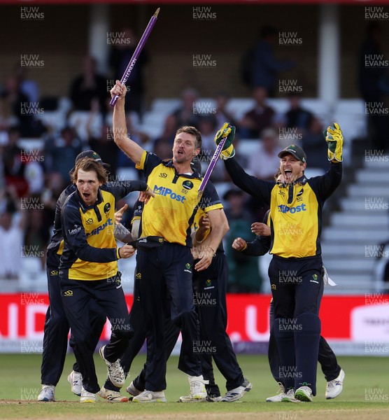 190821 - Glamorgan v Durham - Royal London One Day Final - Michael Hogan of Glamorgan pulls the wicket out the pitch as Glamorgan celebrate winning the game