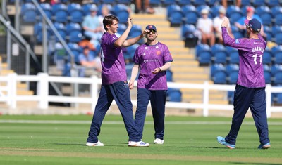 070826 - Glamorgan v Essex, Metro Bank One Day Cup - Mackenzie Jones of Essex celebrates as Harry Wallace of Glamorgan is caught by Simon Fernandes of Essex of his bowling
