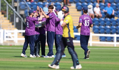 070826 - Glamorgan v Essex, Metro Bank One Day Cup - Mackenzie Jones of Essex celebrates as Harry Wallace of Glamorgan is caught by Simon Fernandes of Essex of his bowling