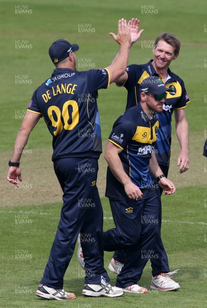 170419 - Glamorgan Cricket v Essex - Royal London One-Day Cup - Michael Hogan of Glamorgan celebrates the wicket of Ryan ten Doeschate with Marchant De Lange who is caught by Kiran Carlson