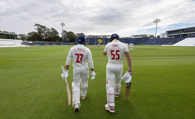 240926 Glamorgan v Essex, Rothesay County Championship Division 1 - Asa Tribe of Glamorgan and Zain ul Hassan of Glamorgan walk out at the start of the innings