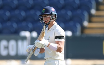 240926 Glamorgan v Essex, Rothesay County Championship Division 1 - Asa Tribe of Glamorgan celebrates as he makes his 50