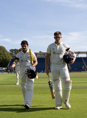 240926 Glamorgan v Essex, Rothesay County Championship Division 1 - Kiran Carlson of Glamorgan, left, and Asa Tribe of Glamorgan leave the pitch at tea on 97 and 88 respectively