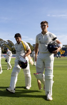 240926 Glamorgan v Essex, Rothesay County Championship Division 1 - Kiran Carlson of Glamorgan, left, and Asa Tribe of Glamorgan leave the pitch at tea on 97 and 88 respectively