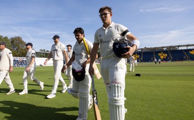 240926 Glamorgan v Essex, Rothesay County Championship Division 1 - Kiran Carlson of Glamorgan, left, and Asa Tribe of Glamorgan leave the pitch at tea on 97 and 88 respectively