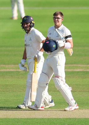 240926 Glamorgan v Essex, Rothesay County Championship Division 1 - Asa Tribe of Glamorgan celebrates with Kiran Carlson of Glamorgan as he makes his 100