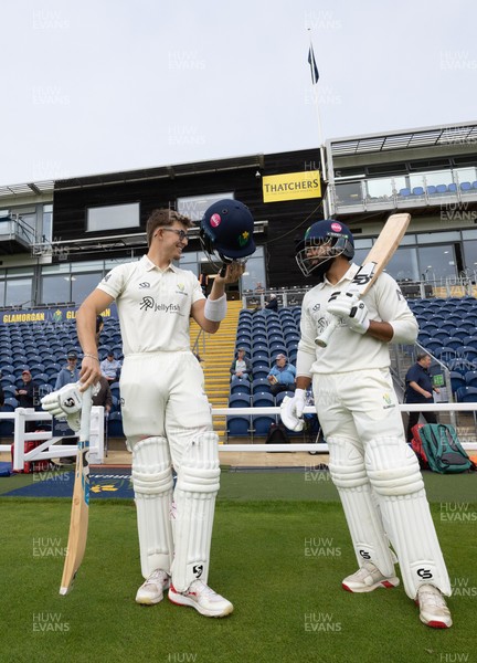 240926 Glamorgan v Essex, Rothesay County Championship Division 1 - Asa Tribe of Glamorgan and Zain ul Hassan of Glamorgan walk out at the start of the innings
