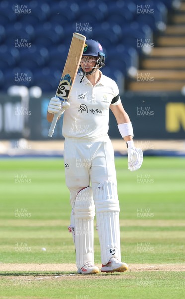 240926 Glamorgan v Essex, Rothesay County Championship Division 1 - Asa Tribe of Glamorgan celebrates as he makes his 50