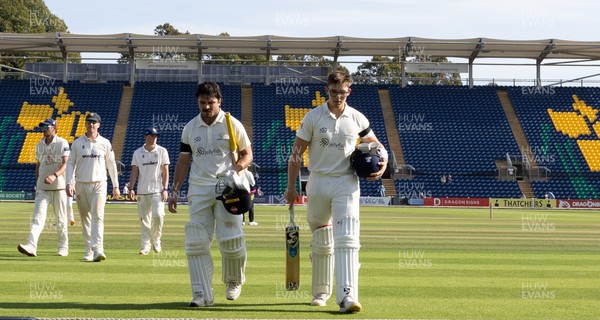240926 Glamorgan v Essex, Rothesay County Championship Division 1 - Kiran Carlson of Glamorgan, left, and Asa Tribe of Glamorgan leave the pitch at tea on 97 and 88 respectively