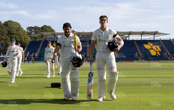 240926 Glamorgan v Essex, Rothesay County Championship Division 1 - Kiran Carlson of Glamorgan, left, and Asa Tribe of Glamorgan leave the pitch at tea on 97 and 88 respectively