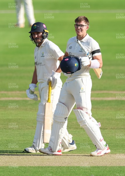 240926 Glamorgan v Essex, Rothesay County Championship Division 1 - Asa Tribe of Glamorgan celebrates with Kiran Carlson of Glamorgan as he makes his 100