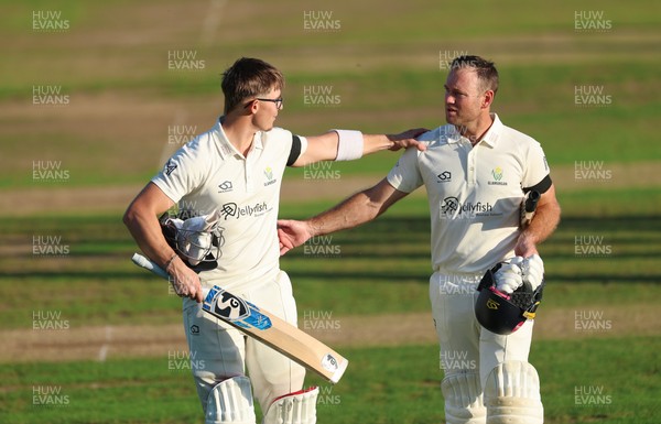 240926 Glamorgan v Essex, Rothesay County Championship Division 1 - Asa Tribe of Glamorgan, left, leaves the pitch at the end of the day’s play on 135 not out, along with Colin Ingram of Glamorgan