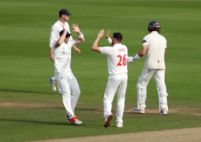 260926 - Glamorgan v Essex - Rothesay County Championship Division 1 - Ray Toole of Glamorgan celebrates taking the wicket of Zaman Akhter with Dan Douthwaite