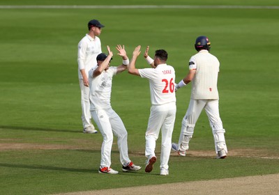 260926 - Glamorgan v Essex - Rothesay County Championship Division 1 - Ray Toole of Glamorgan celebrates taking the wicket of Zaman Akhter with Dan Douthwaite