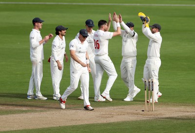 260926 - Glamorgan v Essex - Rothesay County Championship Division 1 - Ray Toole of Glamorgan celebrates taking the wicket of Zaman Akhter with team mates