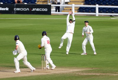 260926 - Glamorgan v Essex - Rothesay County Championship Division 1 - Kiran Carlson of Glamorgan catches the ball to dismiss Sam Cook