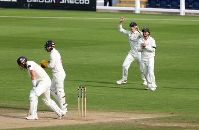 260926 - Glamorgan v Essex - Rothesay County Championship Division 1 - Kiran Carlson of Glamorgan catches the ball to dismiss Sam Cook