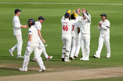 260926 - Glamorgan v Essex - Rothesay County Championship Division 1 - Kiran Carlson of Glamorgan celebrates after catching the ball to dismiss Sam Cook