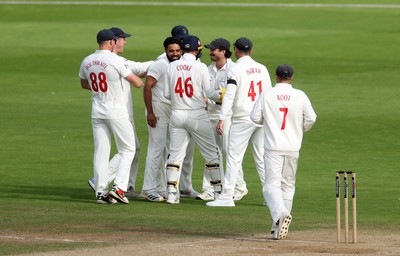 260926 - Glamorgan v Essex - Rothesay County Championship Division 1 - Kiran Carlson of Glamorgan celebrates after catching the ball to dismiss Sam Cook