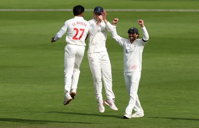 260926 - Glamorgan v Essex - Rothesay County Championship Division 1 - Zain ul Hassan of Glamorgan celebrates taking the wicket of Simon Harmer with Asa Tribe