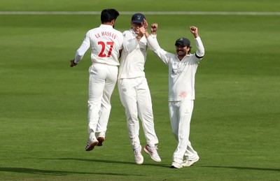 260926 - Glamorgan v Essex - Rothesay County Championship Division 1 - Zain ul Hassan of Glamorgan celebrates taking the wicket of Simon Harmer with Asa Tribe