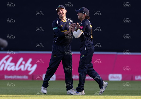 020622 - Glamorgan Cricket v Essex Eagles - Vitality T20 Blast - Kiran Carlson celebrates with Andrew Salter of Glamorgan after catching the ball to dismiss Aron Nijjar of Essex