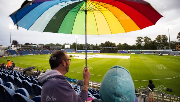 090819 - Glamorgan v Essex Eagles, Vitality Blast - Umbrellas come out as rain interrupts play at Sophia Gardens Cardiff in the Vitality Blast match between Glamorgan and Essex Eagles