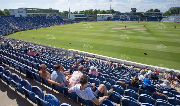 130621 - Glamorgan v Essex Eagles, Vitality Blast - Cricket fans watch the Vitality Blast match between Glamorgan and Essex Eagles after a relaxing of COVID 19 restrictions in Wales