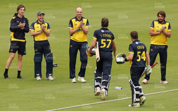 160821 - Glamorgan v Essex Eagles - Royal London One-Day Cup - Joe Cooke of Glamorgan and Tom Cullen celebrate with Glamorgan team mates as they win the game