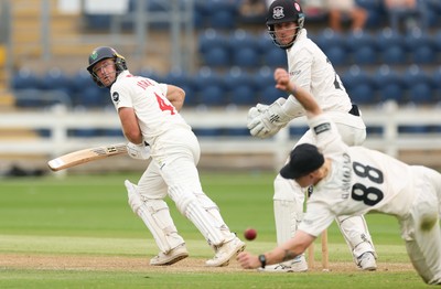 010725  Glamorgan v Gloucestershire, Rothesay County Championship Division 2 - Colin Ingram of Glamorgan plays a shot past Miles Hammond of Gloucestershire