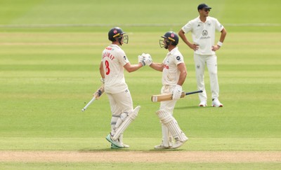 010725  Glamorgan v Gloucestershire, Rothesay County Championship Division 2 - Ben Kellaway of Glamorgan and Colin Ingram of Glamorgan congratulate each other as they both make 100