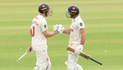 010725  Glamorgan v Gloucestershire, Rothesay County Championship Division 2 - Ben Kellaway of Glamorgan and Colin Ingram of Glamorgan congratulate each other as they both make 100