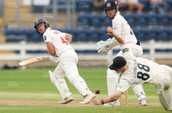 010725  Glamorgan v Gloucestershire, Rothesay County Championship Division 2 - Colin Ingram of Glamorgan plays a shot past Miles Hammond of Gloucestershire