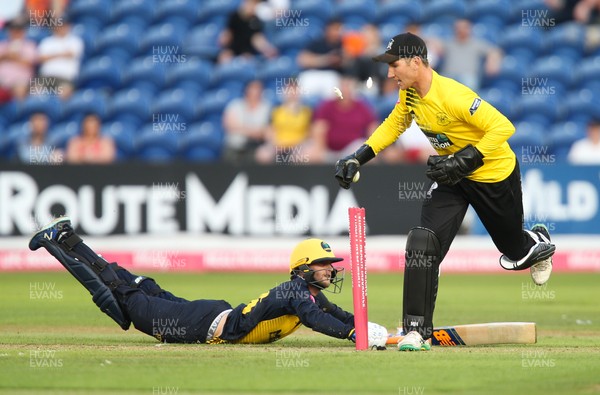 010819 - Glamorgan v Gloucestershire, Vitality Blast 2019 - Billy Root of Glamorgan dives to avoid a runout as James Bracey of Gloucestershire removes the bails