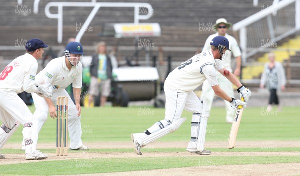 030812 - Glamorgan v Gloucestershire, LV County Championship Division 2 -  Gloucestershire's Ian Cockbain is bowled lbw by Glamorgans' Robert Croft 