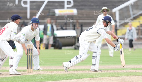 030812 - Glamorgan v Gloucestershire, LV County Championship Division 2 -  Gloucestershire's Ian Cockbain is bowled lbw by Glamorgans' Robert Croft 