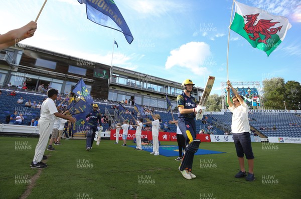 030818 - Glamorgan v Gloucestershire, Vitality Blast - Aneurin Donald of Glamorgan makes his way through the Guard of Honour at the start of the match