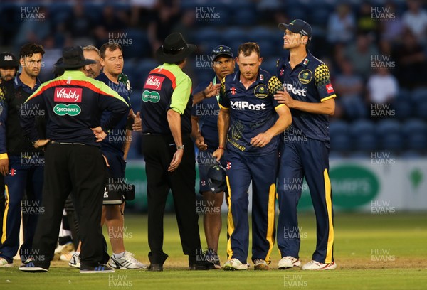 030818 - Glamorgan v Gloucestershire, Vitality Blast - Graham Wagg of Glamorgan is back on his feet and leaving the pitch after being struck by the ball while bowling
